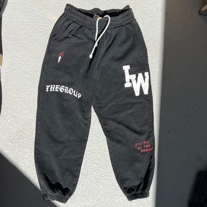 The iron willed “driven by the dream” relaxed black sweats